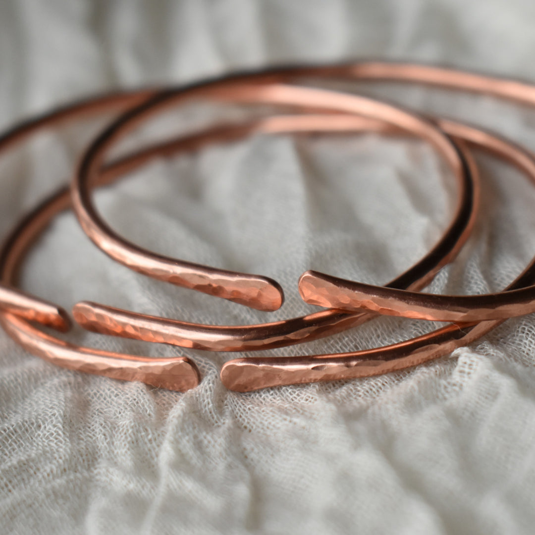 Adjustable copper stacking bracelets available in three sizes