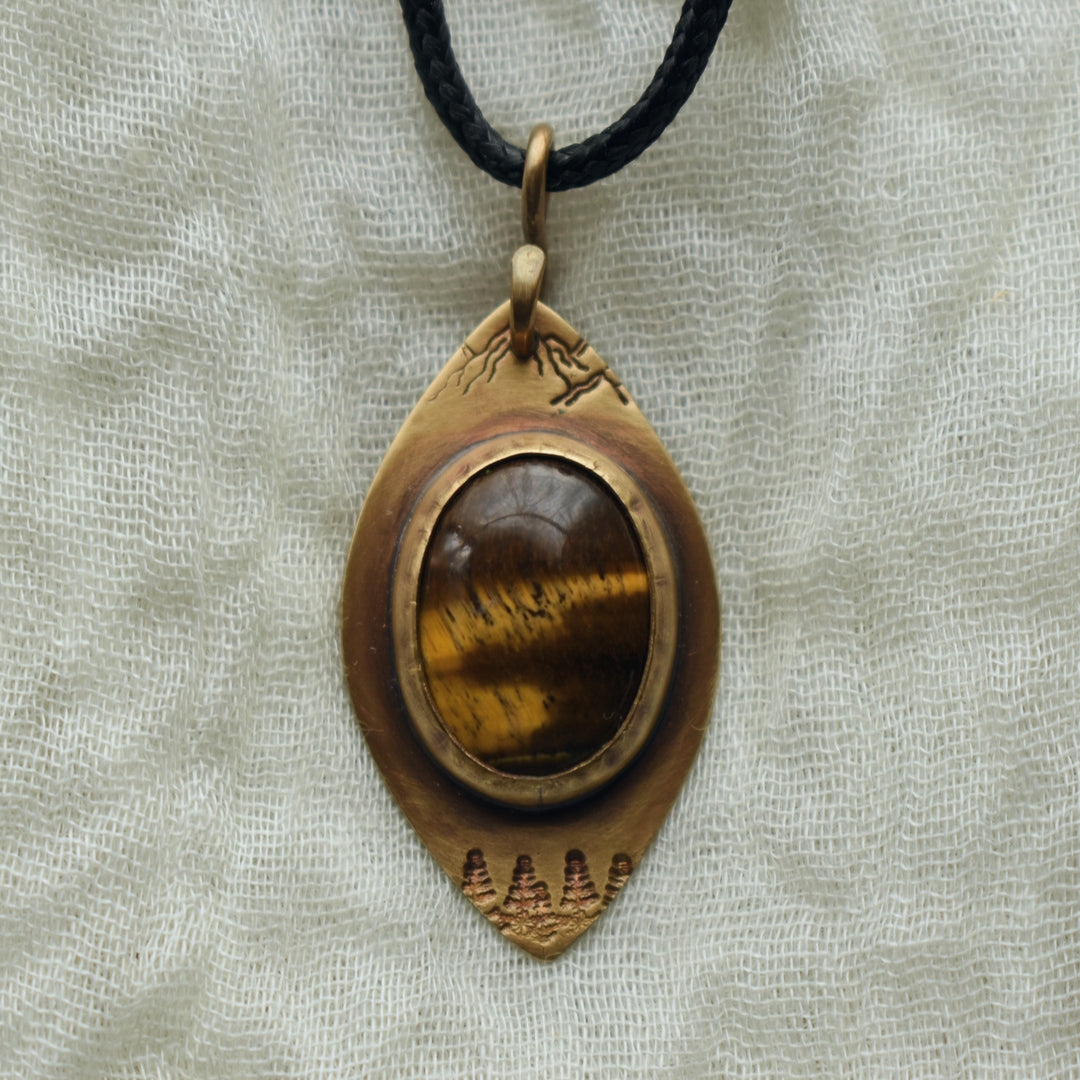 metalsmith pendant necklace in solid brass and tigers eye