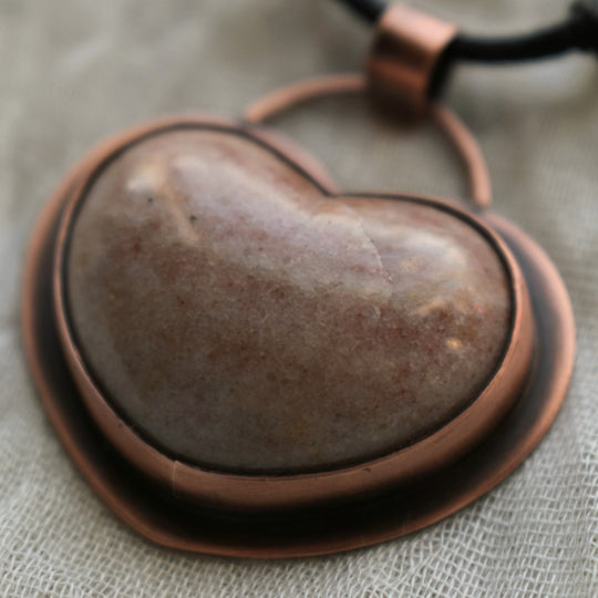 unique copper pendant necklace made with a pink gemstone heart