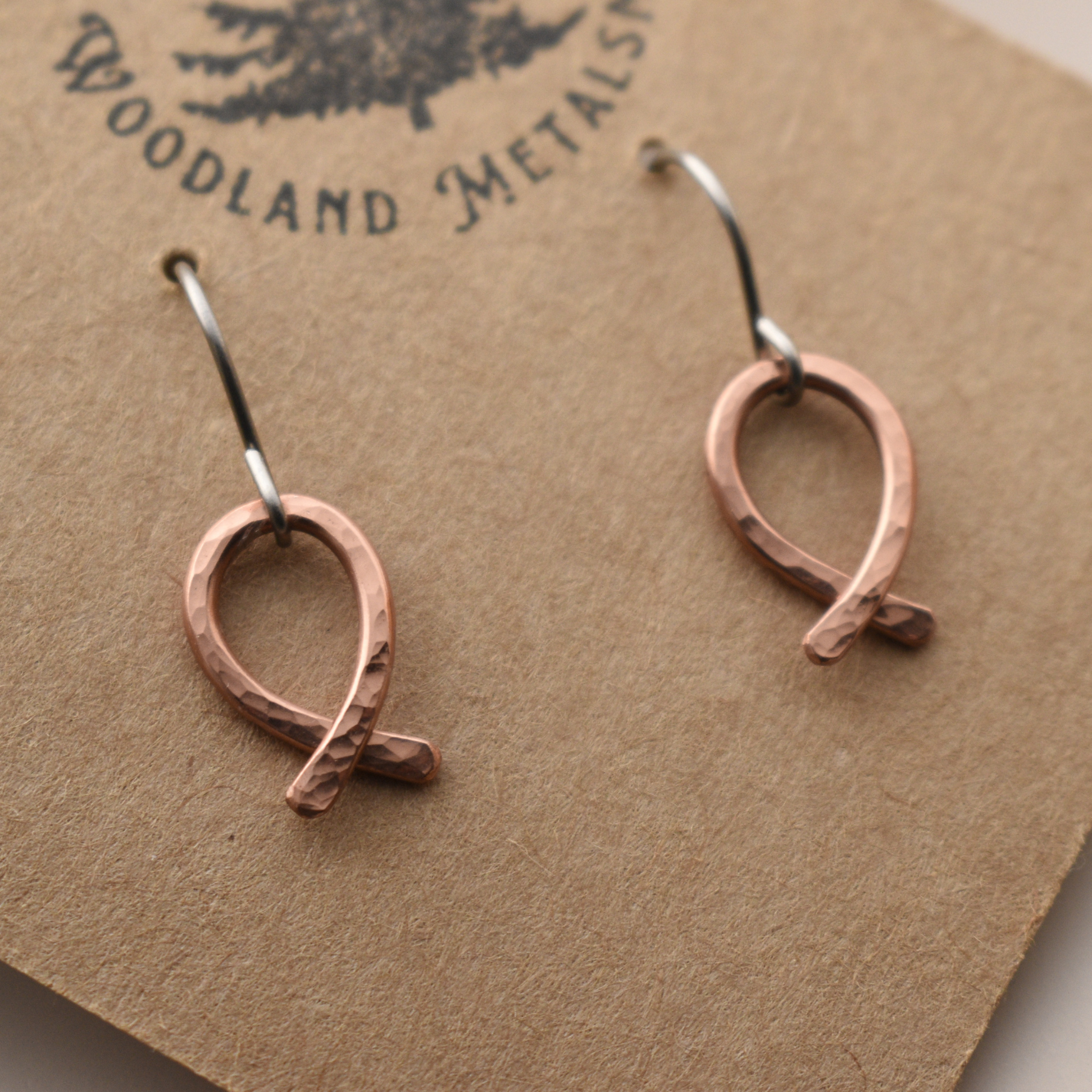 Pair of ribbon shaped copper earrings