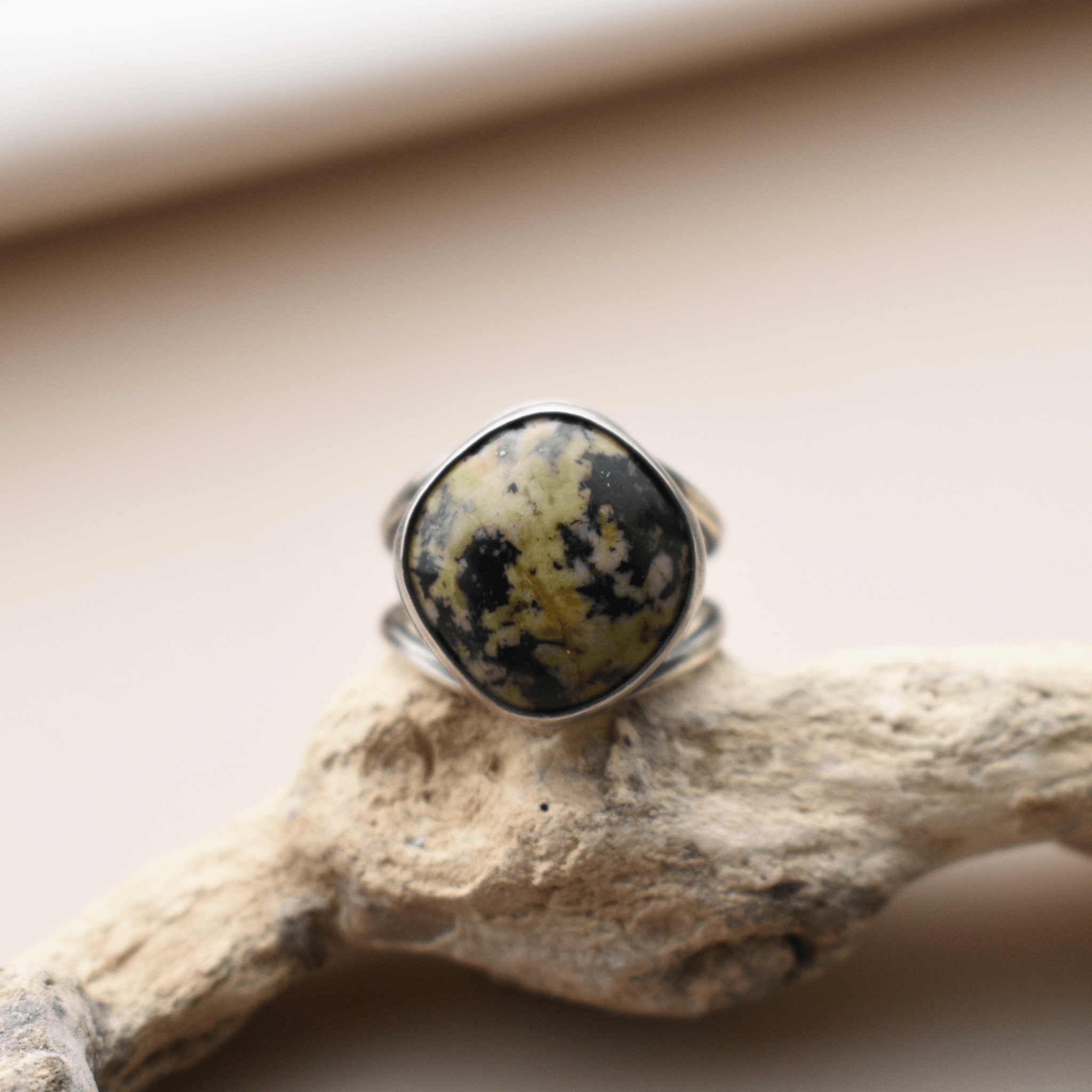 A silver ring with a large stone