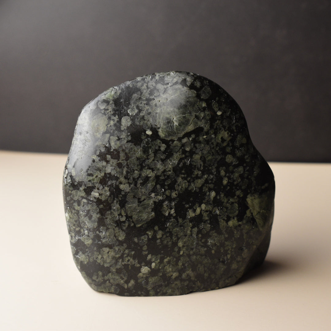 Black stone with Feldspar flakes