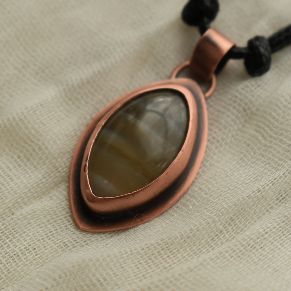 metalsmith pendant necklace handmade with washington banded agate and copper