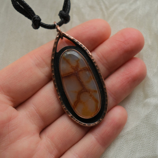 pendant necklace made with carnelian agate and pure copper
