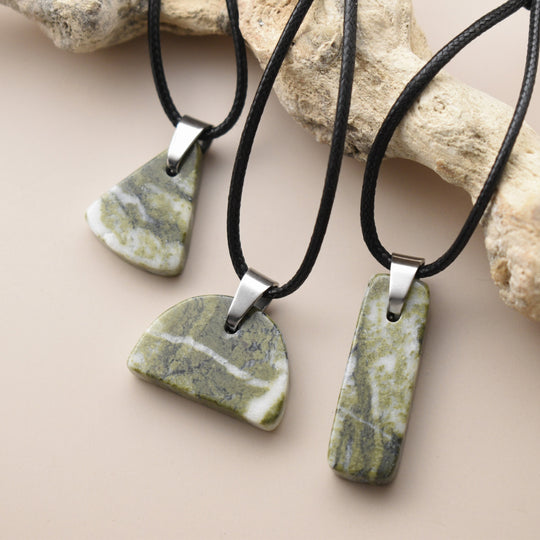 Green stone pendants on black cords