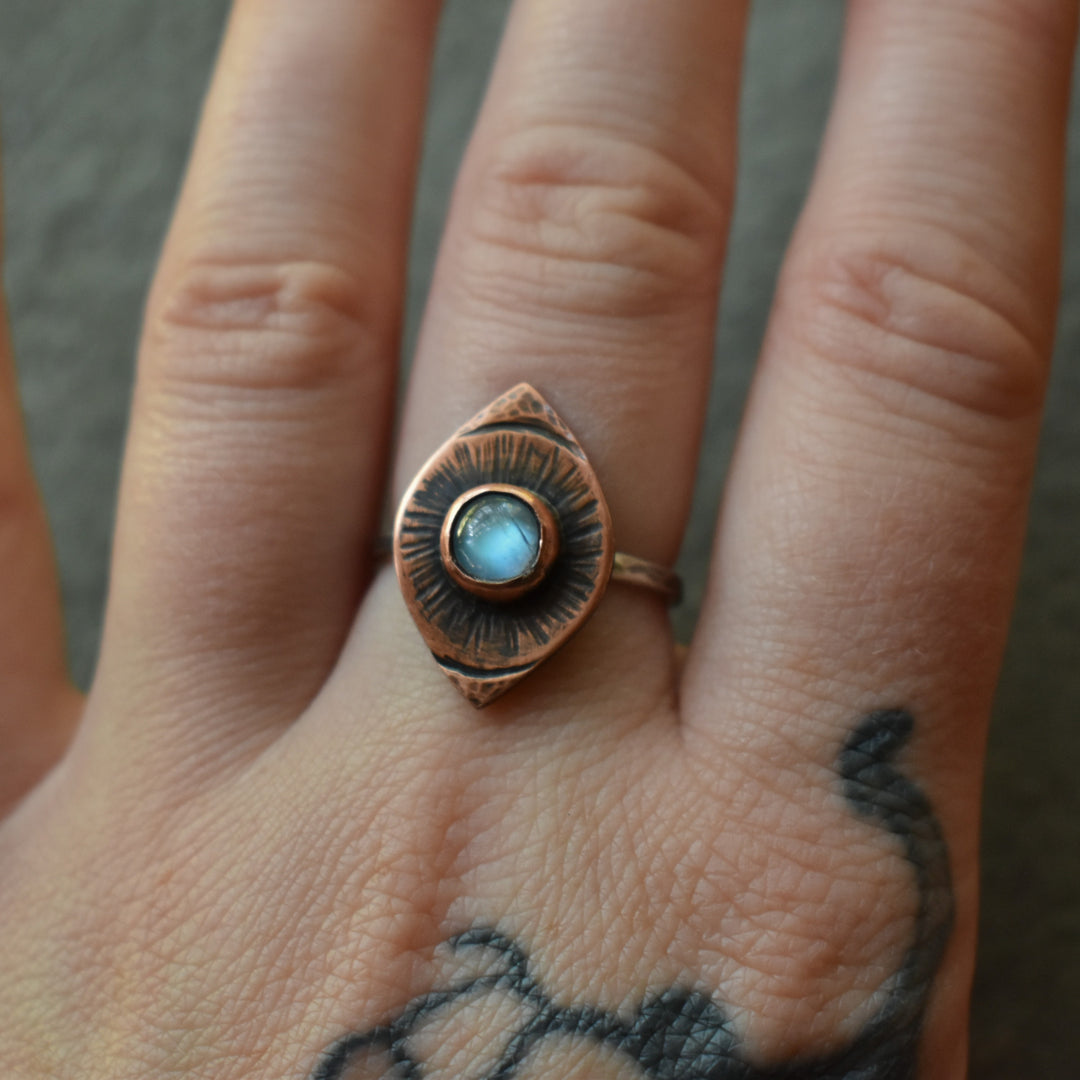 evil eye moonstone ring in copper and sterling silver