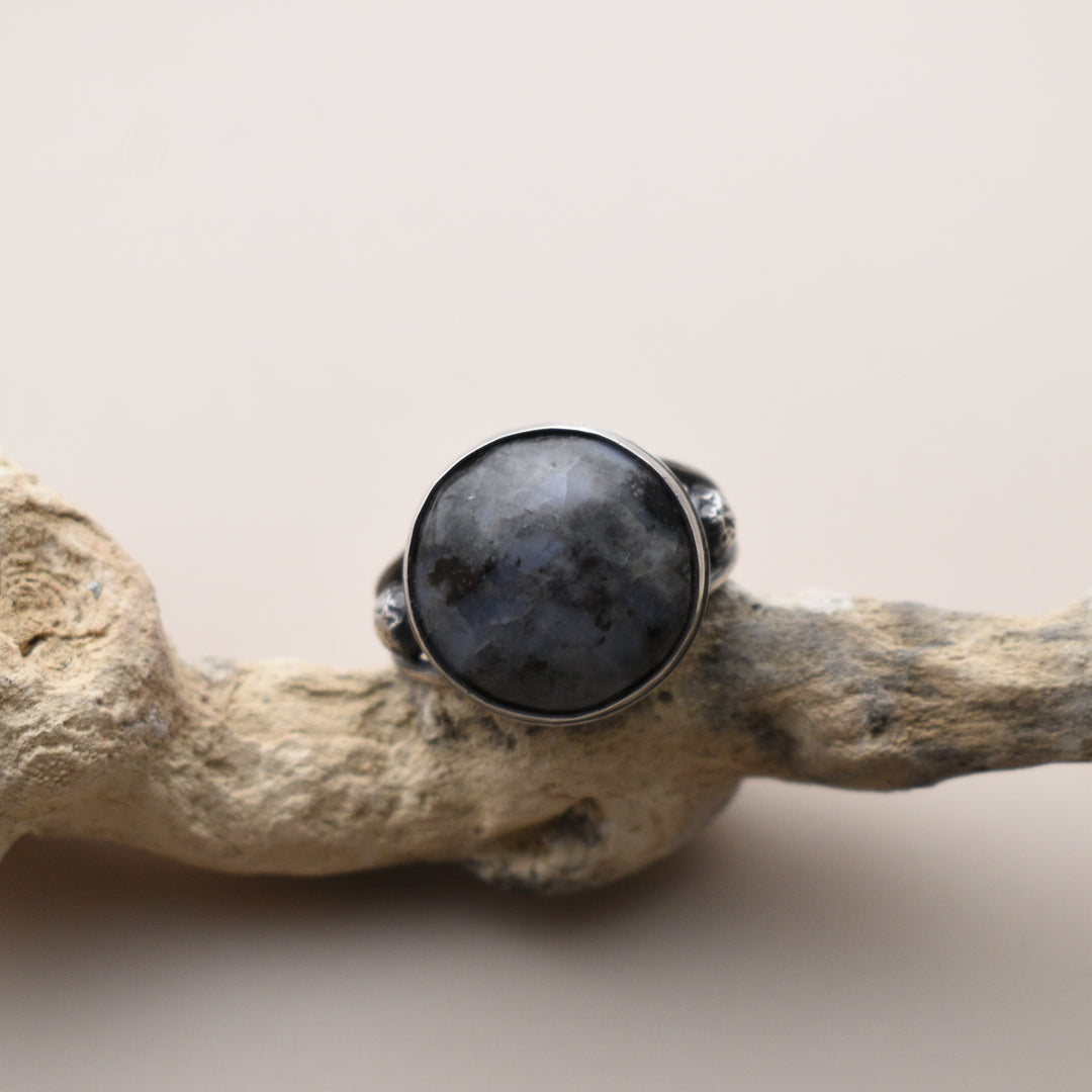 Ring with a Moonstone with a beige background