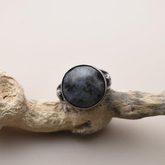 Ring with a Moonstone with a beige background