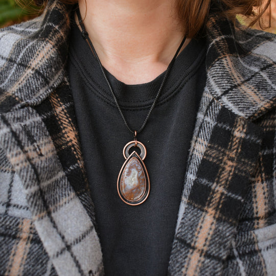 metalsmith pendant necklace made with moss agate and copper