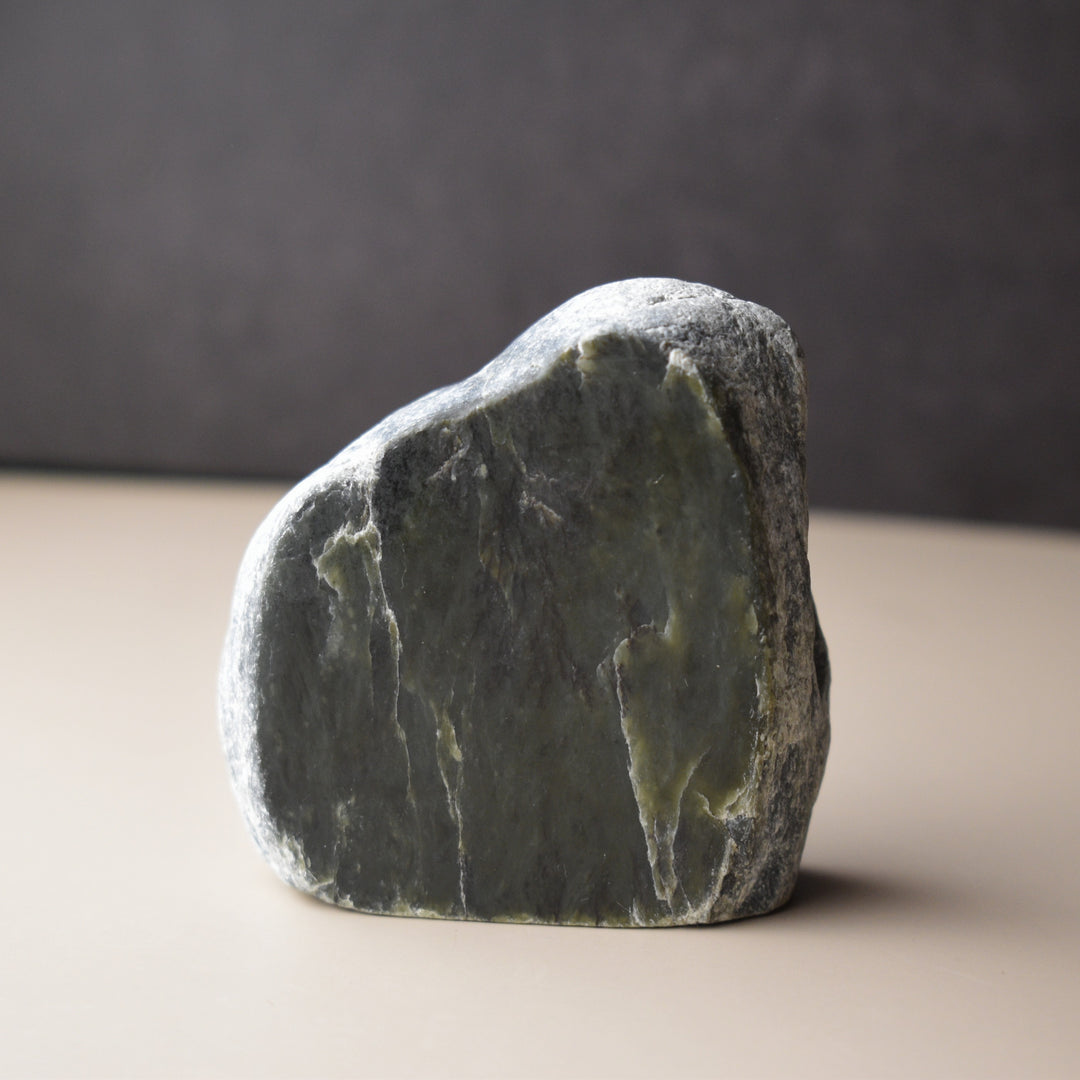 Green stone on a neutral background