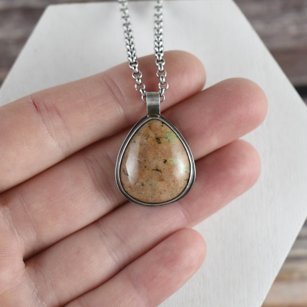 Orange calcite and Sterling silver pendant