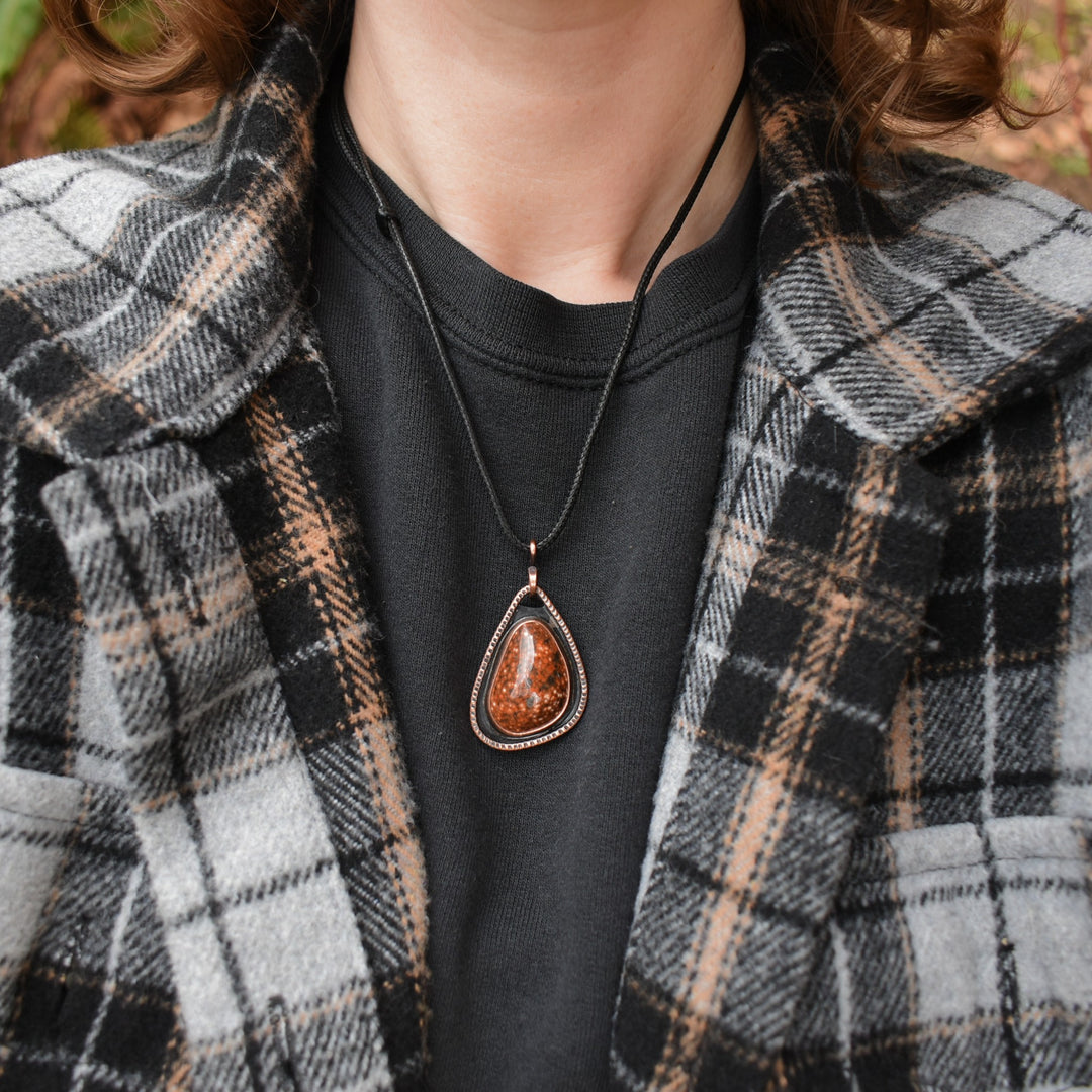 metalsmith pendant necklace made with orbicular jasper and copper