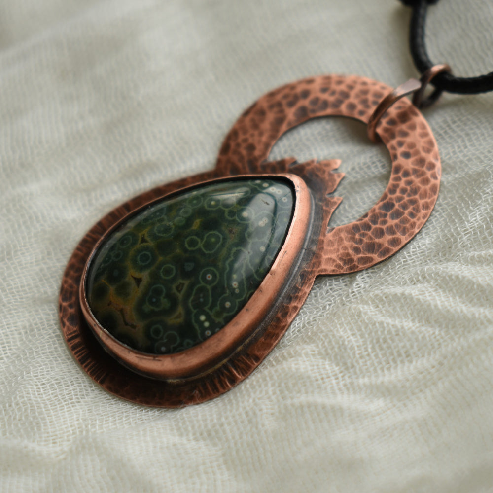 gemstone pendant necklace made with orbicular ocean jasper and copper