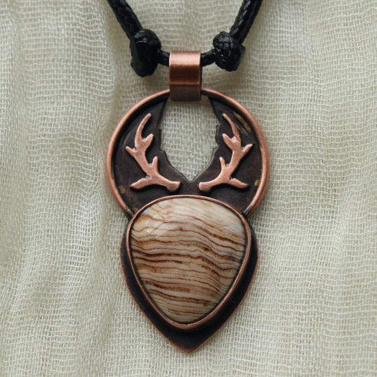 handmade antler pendant necklace in petrified wood and pure copper