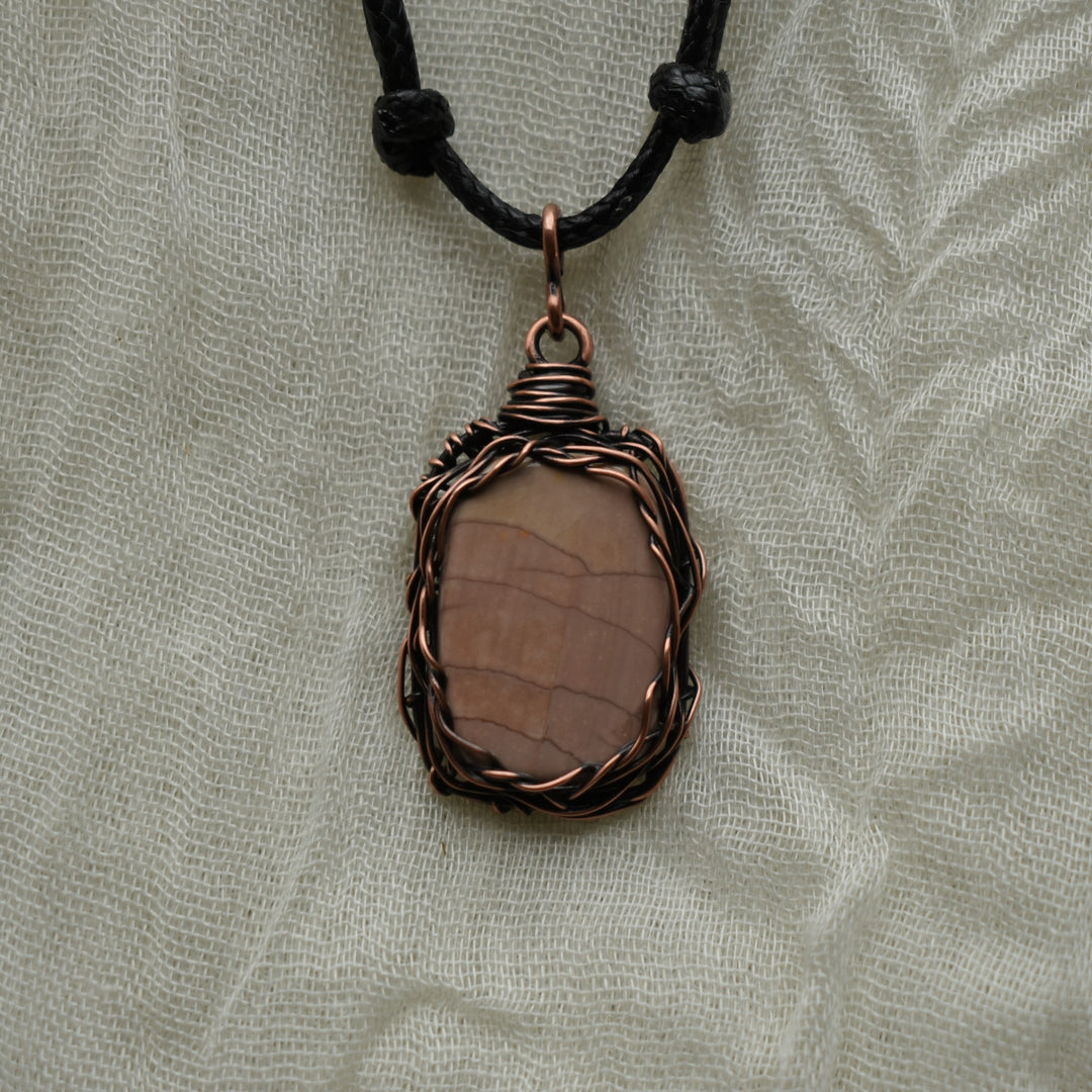 pendant necklace made with pink oregon jasper and copper