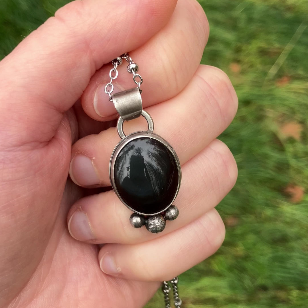 Silver and obsidian glass pendant necklace