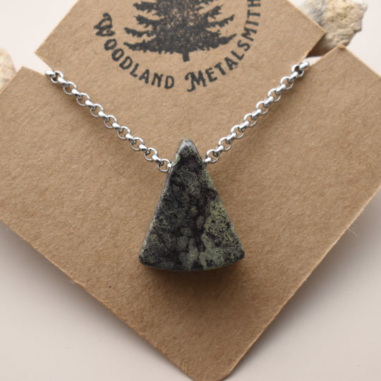 Necklace with a triangular Jasper pendant on a 'Woodland Metalsmith' branded card.