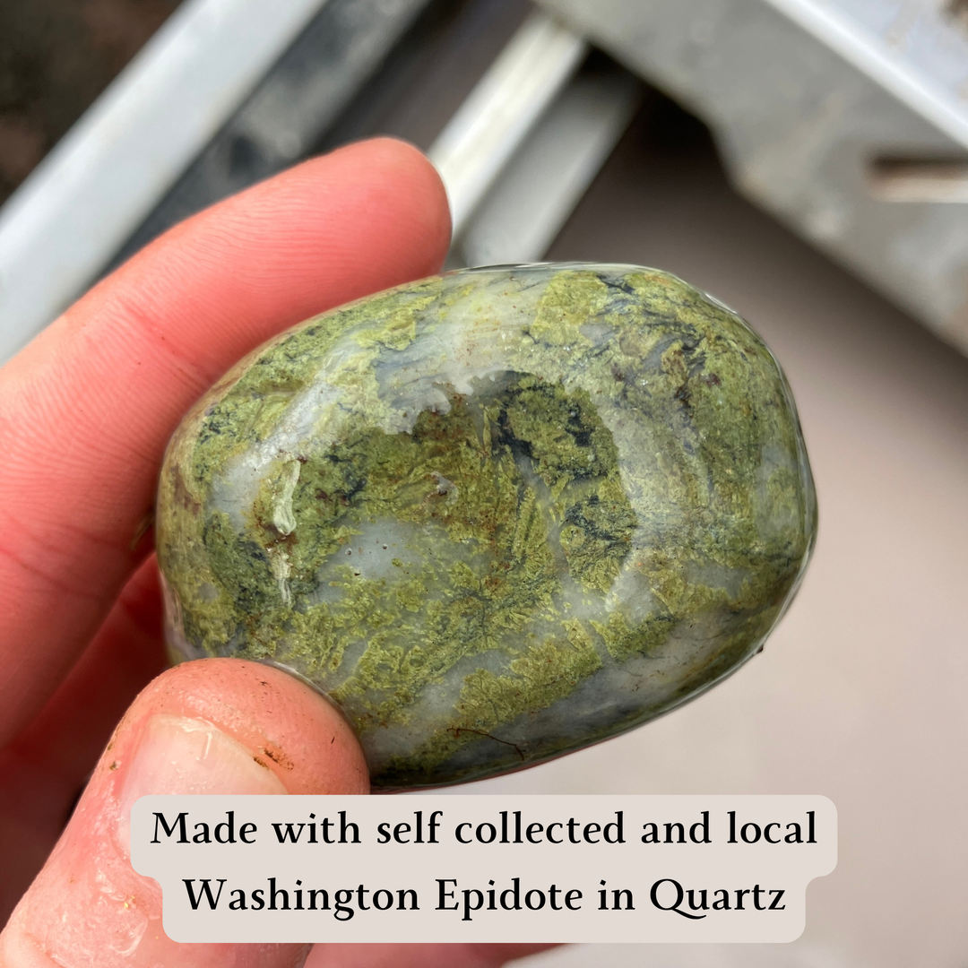 Hand holding a green epidote crystal with text about self-collected Washington Epidote in quartz.
