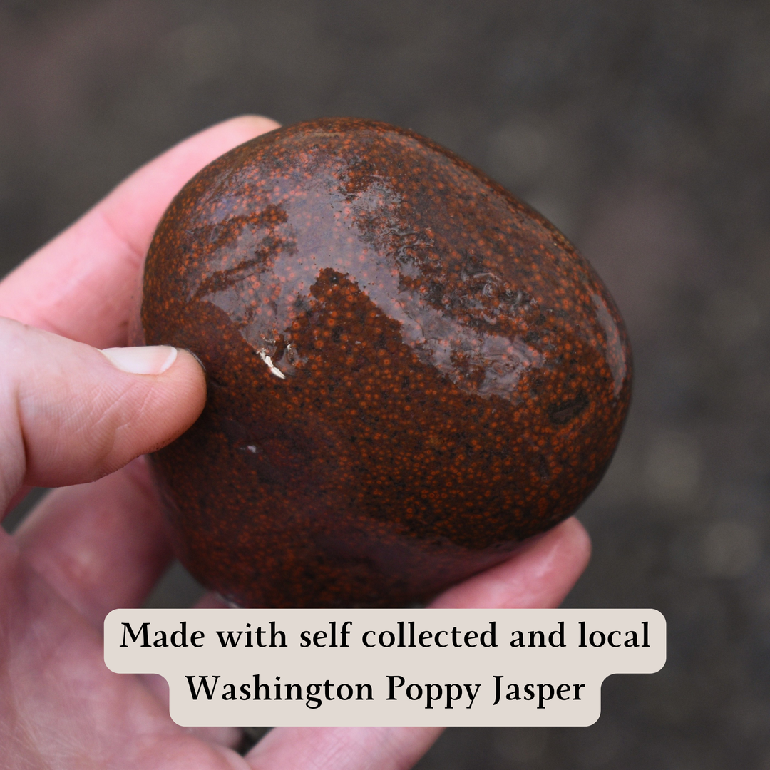 Hand holding a orbicular jasper stone with text about local Washington Poppy Jasper